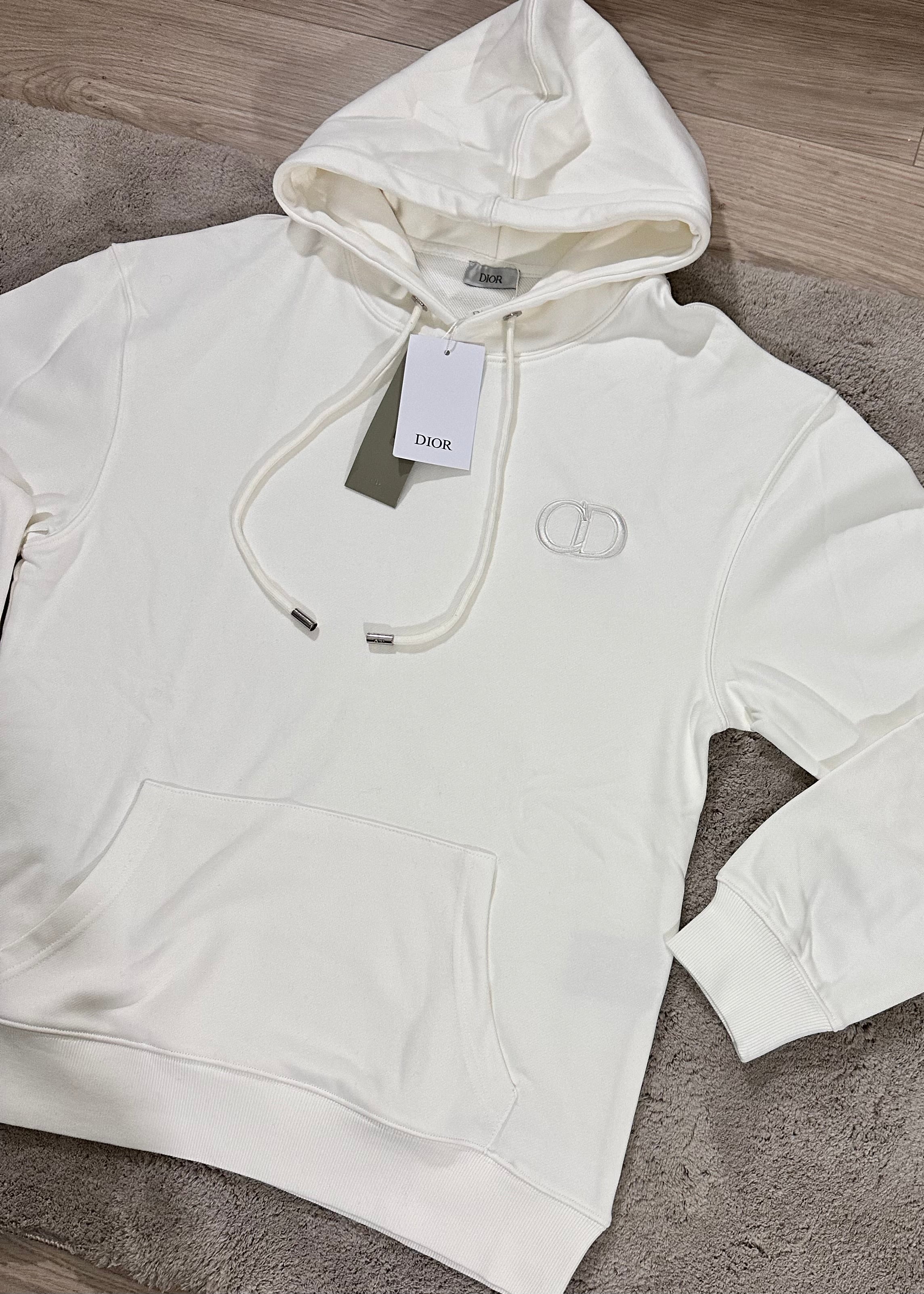 Pull blanc à motif CD